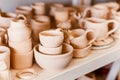 Empty clay pots drying on shelf Royalty Free Stock Photo