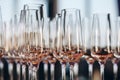 Empty clean champagne glasses on counter in bar.