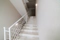 Empty clean room with stairs and white metal railings in the house Royalty Free Stock Photo