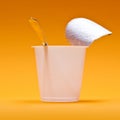 empty clean yogurt cup with spoon on an orange background Royalty Free Stock Photo