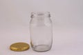 Empty clear glass jar against a white background