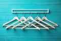 Empty Clothes Hanger Rack Against a Vibrant Turquoise Background Versatile Retail Display for Fashion Photography and