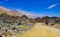 Empty coast sand dirt road track between rocks and mountains in wild dry arid desert landscape - Pan de Azucar, Chile Royalty Free Stock Photo