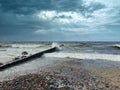 Empty coast stormy Baltic sea under dramatic sky Royalty Free Stock Photo