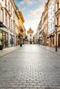Empty cobblestone old town street in Cracow, Poland at sunrise