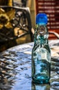 Empty Codd-neck bottle on a table