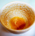 An empty coffee cup after drinking with coffee residue pattern