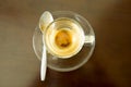 Empty coffee cup and teaspoon after drink coffee on wood table Royalty Free Stock Photo