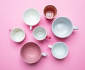 Empty coffee cups white and pink color against pink background Royalty Free Stock Photo