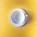 Empty coffee or tea cup on yellow color background, copy space. Royalty Free Stock Photo