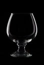 Empty cognac glass on black background studio shot Royalty Free Stock Photo