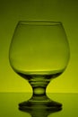 Empty cognac glass studio light green shot 9 Royalty Free Stock Photo