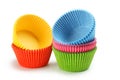 Empty colorful cupcake cases isolated on white background