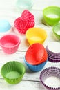 Empty colorful cupcake cases on wooden background Royalty Free Stock Photo