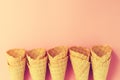 Empty Colorful Pastel Toning Ice Cream Cones on Pink Background. Royalty Free Stock Photo