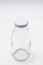 Empty colorless glass bottle