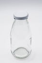 Empty colorless glass bottle