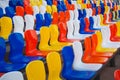 Colourful plastic seats at football stadium