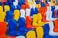 Empty colourful seats at football stadium