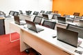 Empty computer classroom with monitors on top of table Royalty Free Stock Photo