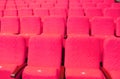 Empty concert hall, theater chairs background ... color photo, empty cinema or concert hall. The red chairs in the
