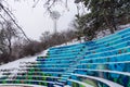 Empty concrete benches in open-air theatre in Botanical Garden under snow, Ankara Turkey