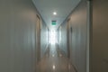 Empty condo, hotel or apartment corridor hall way in condominium building, modern interior design decoration room. Walkway Royalty Free Stock Photo