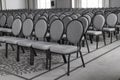 Empty conference hall. Empty rows of chairs. Monochrome Royalty Free Stock Photo