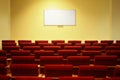 Empty conference hall with screen. rows of chairs