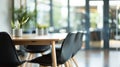 Empty conference room contemporary office with stylish black chairs surrounding wooden table set against large windows Royalty Free Stock Photo