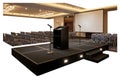 Empty conference room stage setup with seating and projection screen ready for presentation Royalty Free Stock Photo