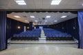 Empty conference,theater or cinema hall with rows of blue seats