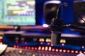 Empty control room with professional recording microphone and technical gear