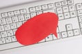 Empty copy space red note paper bubble above pc keyboard for text message. Business concept with blank note papers for Royalty Free Stock Photo