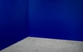 Empty corner navy blue wall and grey concrete floor perspective