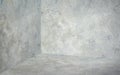 Empty corner room with grey concrete wall and floor background,Mock up studio room for display or montage of product for