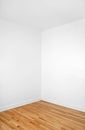 Empty corner of a room with wooden floor Royalty Free Stock Photo