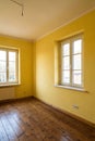Empty corner yellow room with light from window Royalty Free Stock Photo