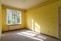 Empty corner yellow room with light from window Royalty Free Stock Photo