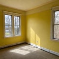 Empty corner yellow room with light from window Royalty Free Stock Photo
