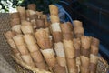 Empty cornets to contain fried food on a hamper with a chair