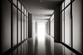 empty corridor floods light from large windows made in minimalist interior design in office building