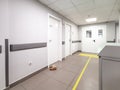 Empty corridor of a hospital polyclinic with doctors' offices. Royalty Free Stock Photo