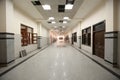 Empty corridor of a newly constructed hospital building with grey tiles and marbles. Royalty Free Stock Photo