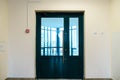 An empty corridor in an office building. Closed doors to the office and lobby. A spacious bright hall in the business center. Royalty Free Stock Photo