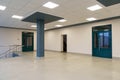 An empty corridor in an office building. Closed doors to the office and lobby. A spacious bright hall in the business center. Royalty Free Stock Photo