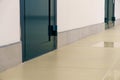 An empty corridor in an office building. Closed doors to the office and lobby. A spacious bright hall in the business center. Royalty Free Stock Photo