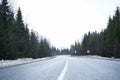Empty country road in winter, roadside in the snow. Road trip concept. Winter trip Royalty Free Stock Photo