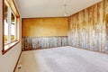 Empty countryside house interior. Orange wall with wooden plank