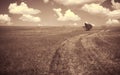 Empty countryside road through fields with cloud. Royalty Free Stock Photo